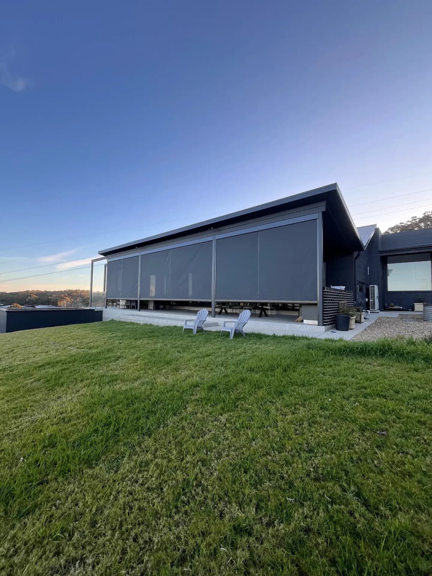 Contemporary house with zipscreen installation and outdoor area