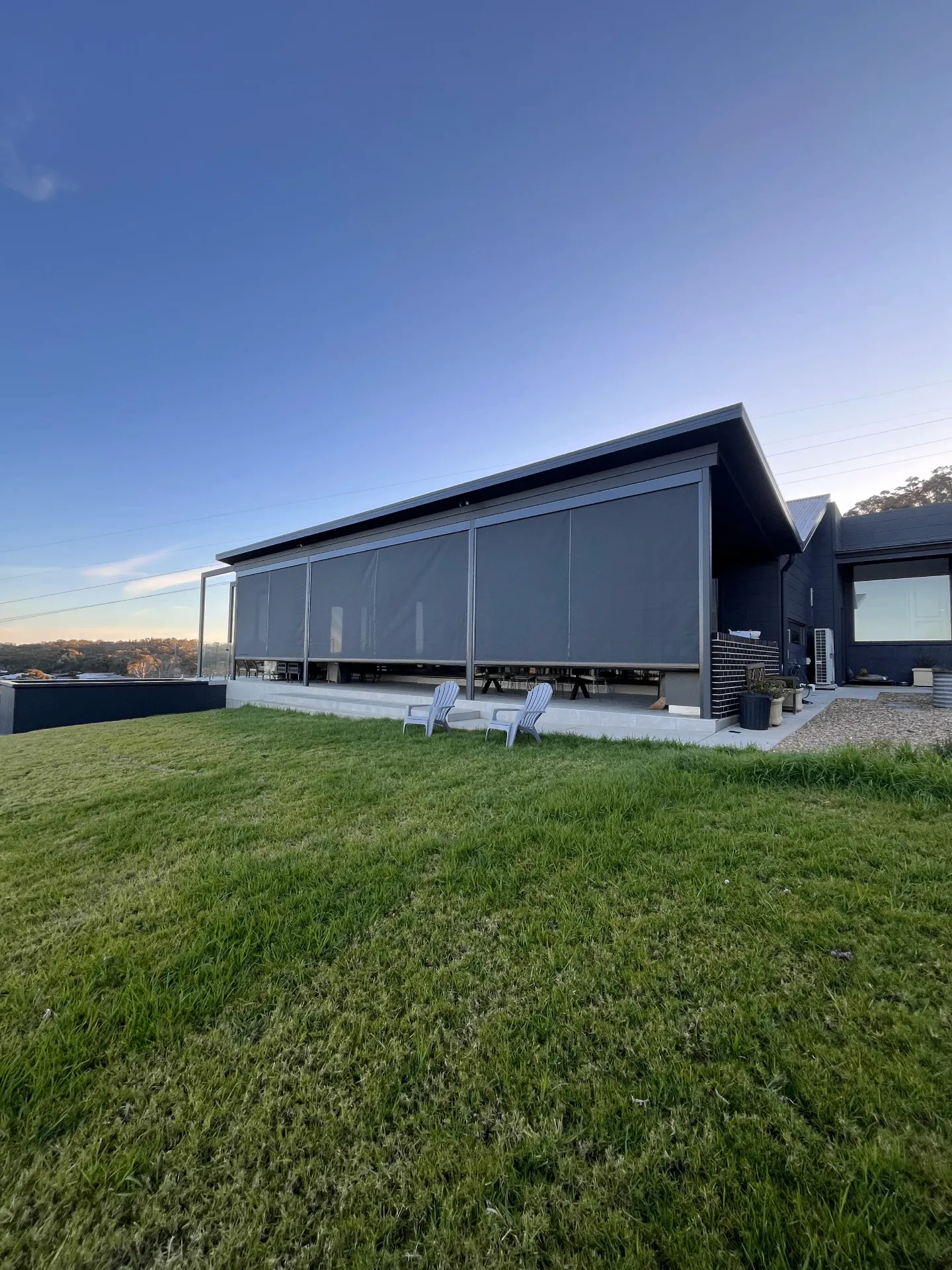 Contemporary house with zipscreen installation and outdoor area