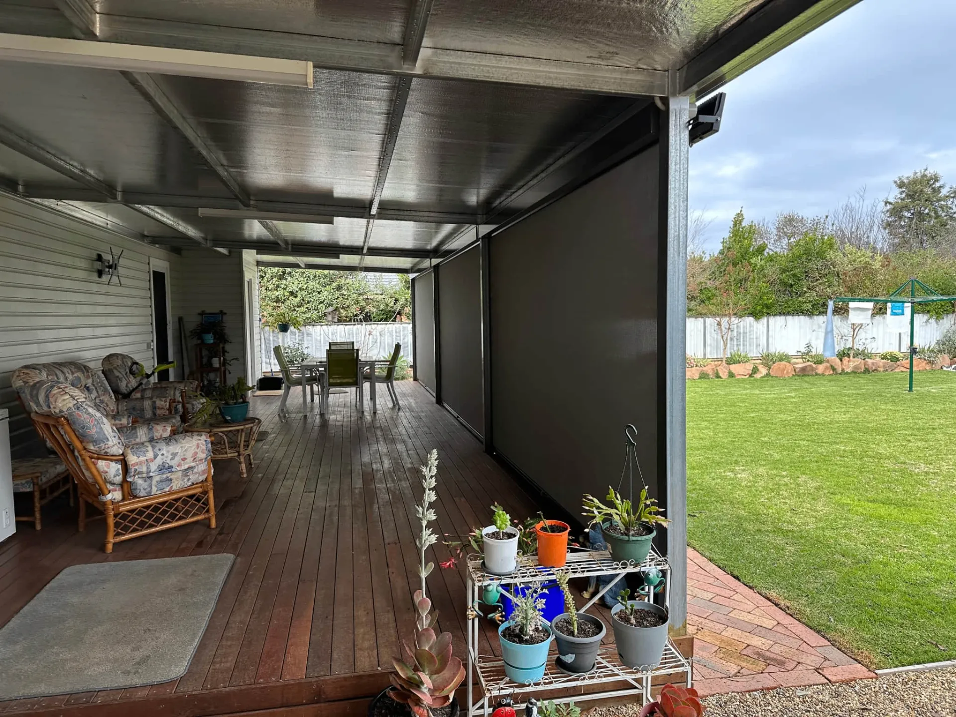 Cozy outdoor living space protected by zipscreens