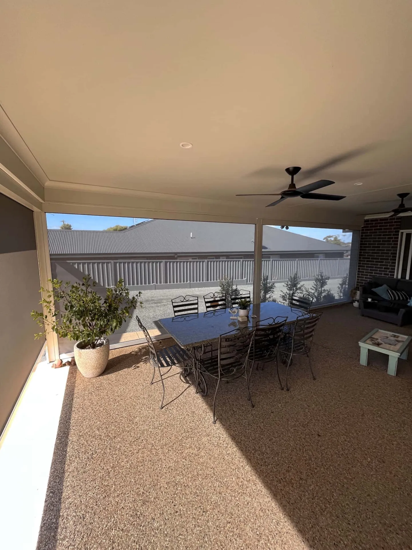 Inside view of enclosed alfresco with zipscreens and outdoor dining