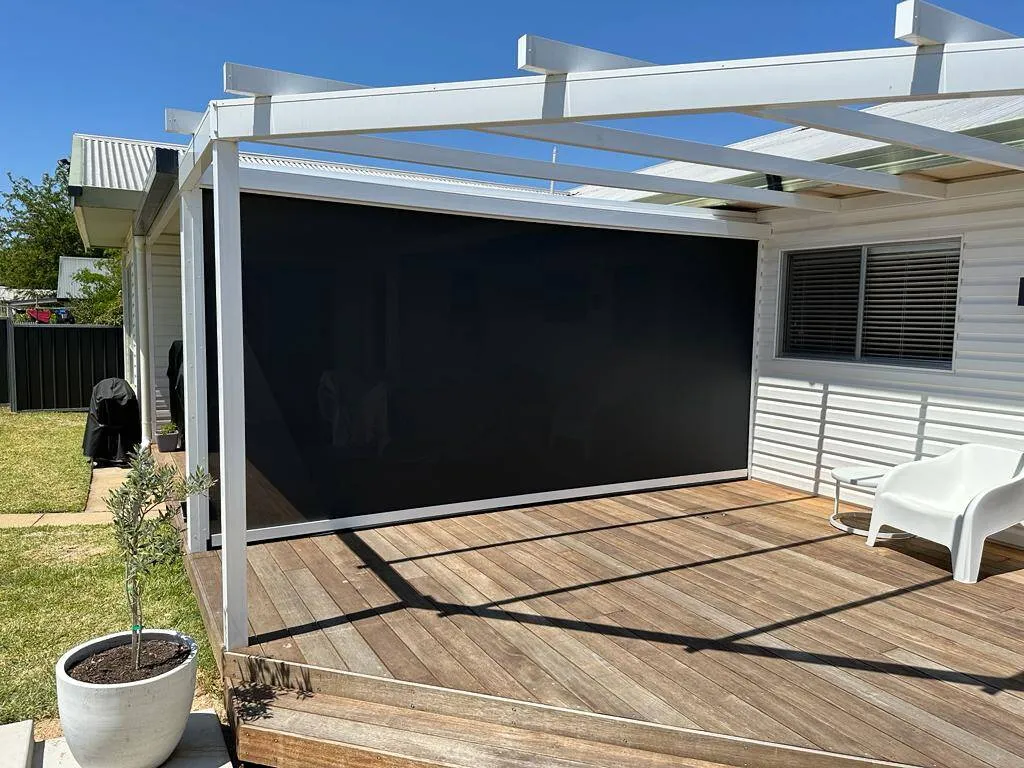Pergola with outdoor blind installation on timber deck