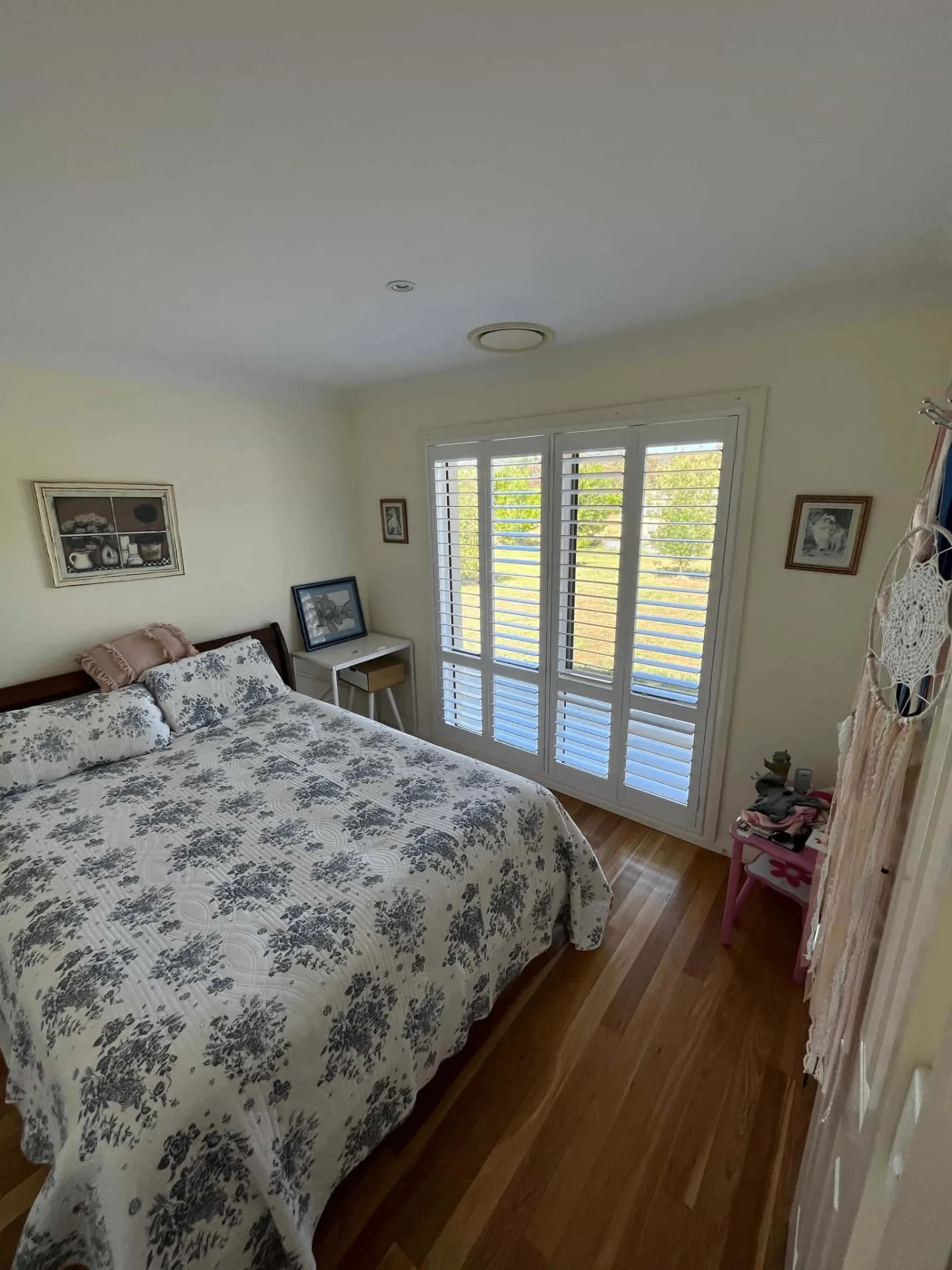 Bayview ThermoPoly plantation shutters on a west-facing window reducing afternoon heat