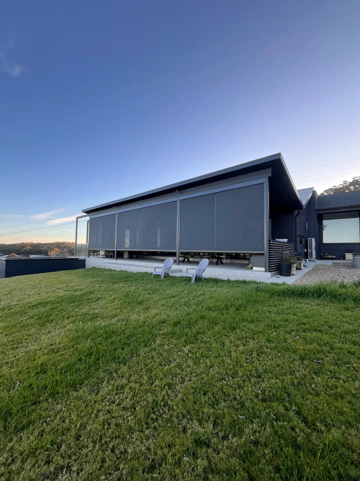 Contemporary house with zipscreen installation and outdoor area